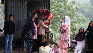 Kashmiri villagers move towards safer places after they evacuated their village following overnight shelling, in Uri, India-administered Kashmir